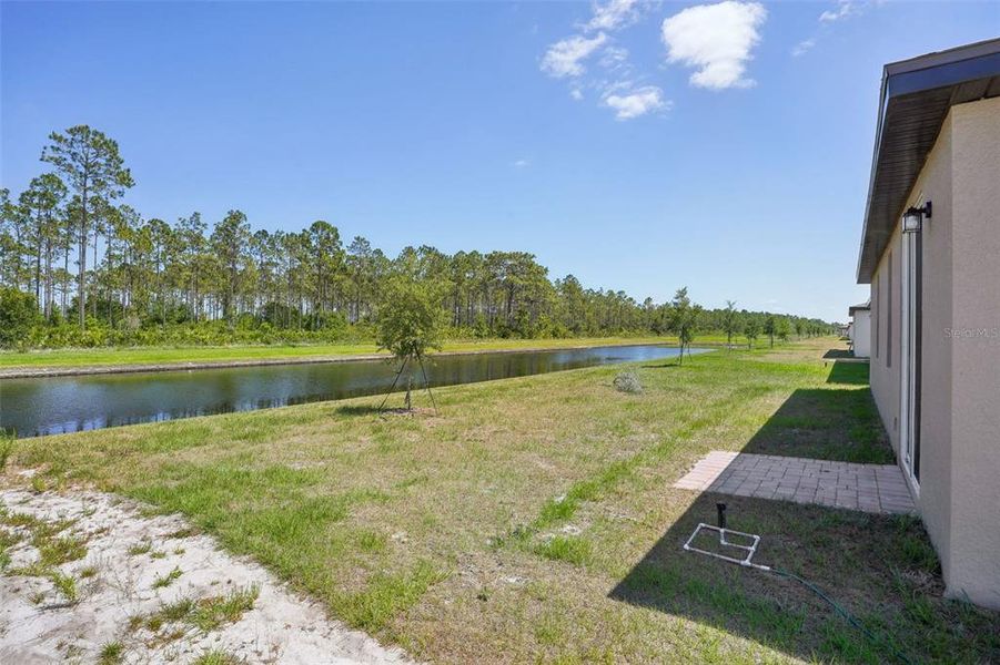Exterior details and patio area of a home in Lake Deer Estates - Signature Series, Poinciana (Image 22). Exterior details and patio area of a home in Lake Deer Estates - Signature Series, Poinciana (Image 22).