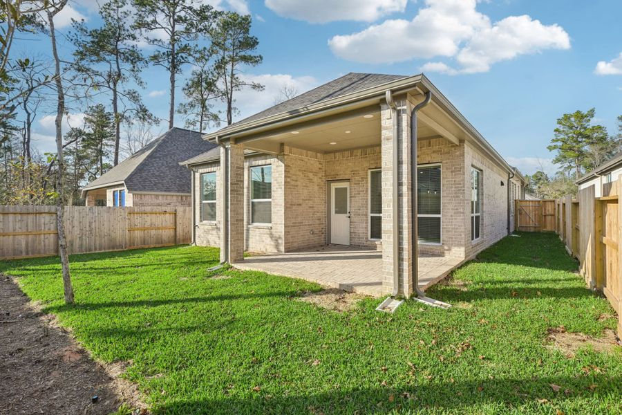 Exterior details and patio area of a home in The Woodlands Hills, Willis (Image 4).