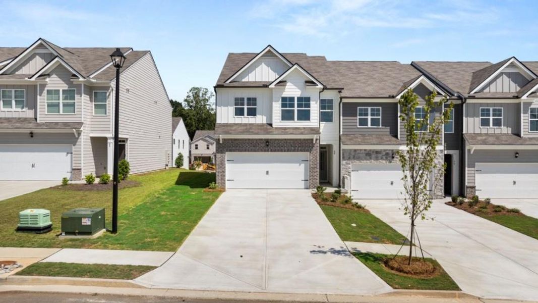 Front exterior of a new home in Rolling Meadows, Jasper, GA, highlighting curb appeal (Image 1). Front exterior of a new home in Rolling Meadows, Jasper, GA, highlighting curb appeal (Image 1).