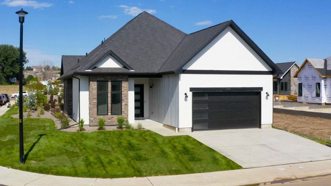 Representative exterior photo of a completed home built from the The Riviera by Trumark Homes in Pelican Shores at Water Valley, Windsor, CO (Image 23). Representative exterior photo of a completed home built from the The Riviera by Trumark Homes in Pelican Shores at Water Valley, Windsor, CO (Image 23).