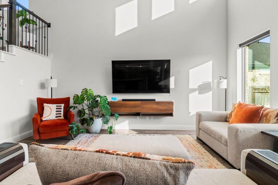 The Kitchen, Living Room, and Breakfast Nook flow seamlessly in this amazing floor plan. Motorized blinds are just another perk of this great room!