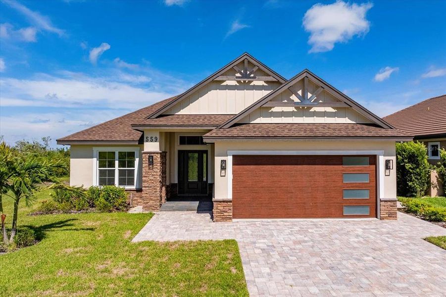 Front exterior of a new home in , Auburndale, FL, highlighting curb appeal (Image 2).