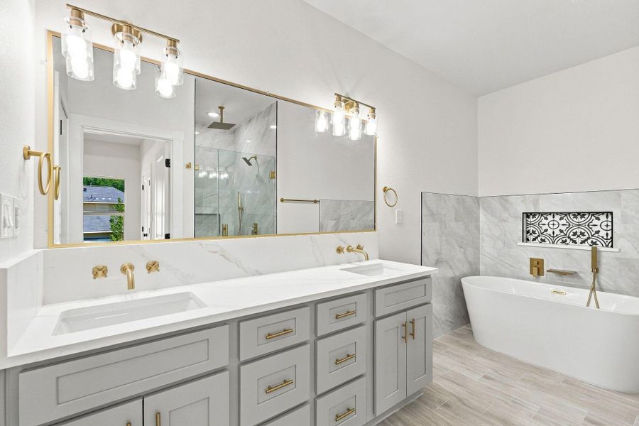 Elegant light gray shaker cabinetry offering abundant storage space.