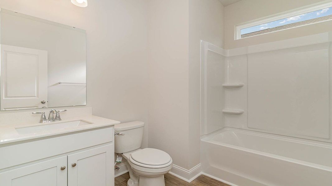 Representative furnished interior of a home built from the FORRESTER by D.R. Horton in Shell Pointe, Gilbert (Image 9).