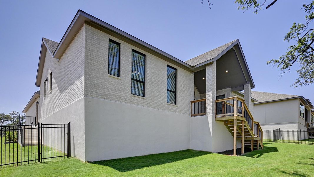 Front exterior of a new home in Esperanza 80', Boerne, TX, highlighting curb appeal (Image 23).