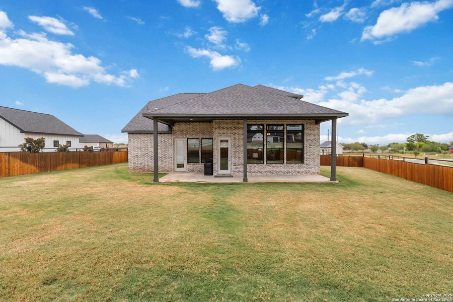 Front exterior of a new home in Woodbridge Farms, La Vernia, TX, highlighting curb appeal (Image 28).