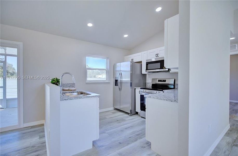 Furnished interior view inside a new home in , Avon Park (Image 6).