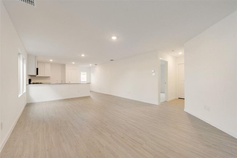 Unfurnished living room with light hardwood / wood-style floors