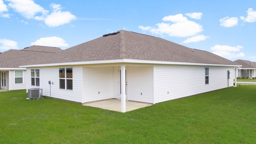 Front exterior of a new home in Titus Park, Panama City, FL, highlighting curb appeal (Image 16). Front exterior of a new home in Titus Park, Panama City, FL, highlighting curb appeal (Image 16).
