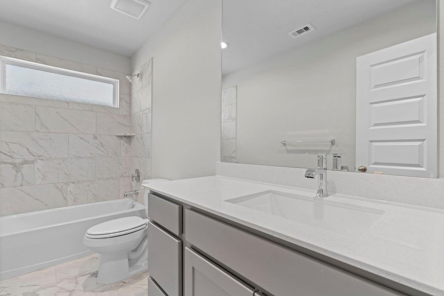 Furnished interior view inside a new home in Barton Creek Ranch, Conroe (Image 10).