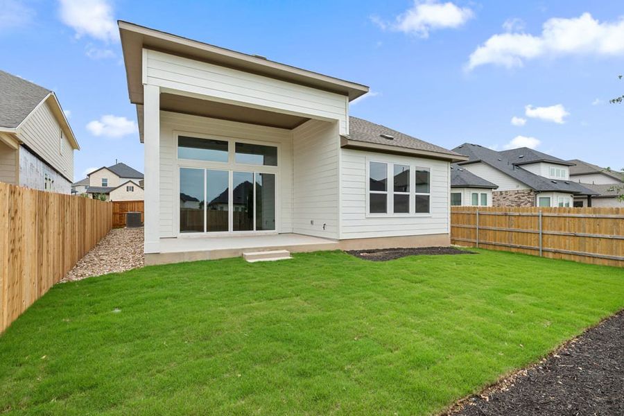 Exterior details and patio area of a home in Heritage, Dripping Springs (Image 26).