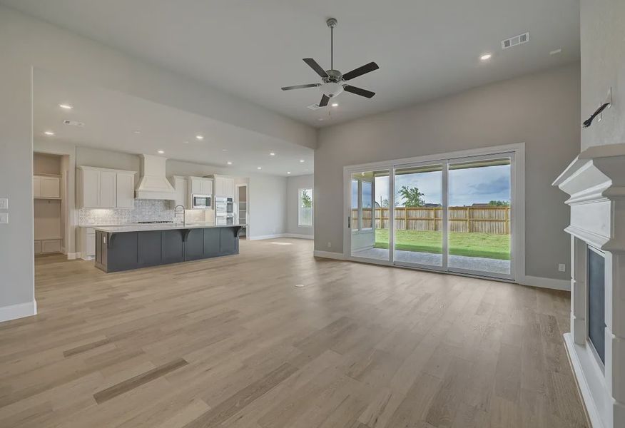 Plan 6025 great room w/ fireplace, SS doors, EOL - 4 of 21 Plan 6025 great room w/ fireplace, SS doors, EOL - 4 of 21