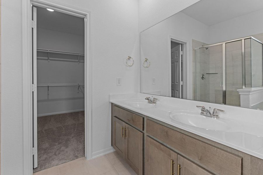 The en-suite bathroom offers a spa-like atmosphere with its elegant design, high end finishes, and tasteful lighting, creating a retreat within your own home. The en-suite bathroom offers a spa-like atmosphere with its elegant design, high end finishes, and tasteful lighting, creating a retreat within your own home.