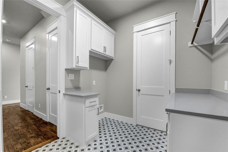 Full bathroom featuring tile floors, vanity, toilet, and tiled shower / bath combo