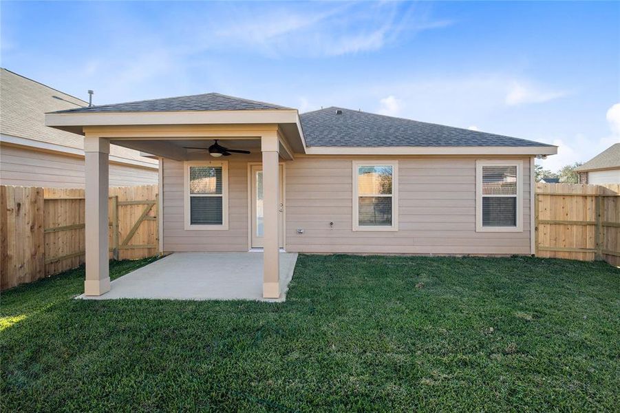 Come and see this spacious backyard with covered rear patio! There is plenty of room for the kids to play and adults to relax!