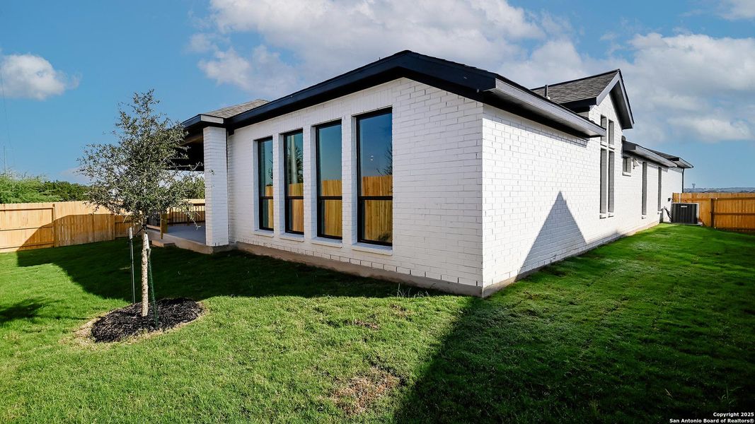 Exterior details and patio area of a home in Cibolo Valley Heights 65', Cibolo (Image 3).