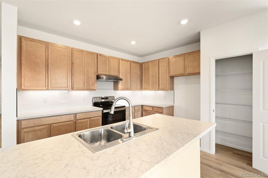 Furnished interior view inside a new home in Turnberry, Commerce City (Image 9).