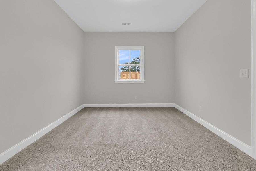 Spacious, unfurnished interior of a new home in Tidewater at Lakes of Cane Bay, Summerville (Image 27).