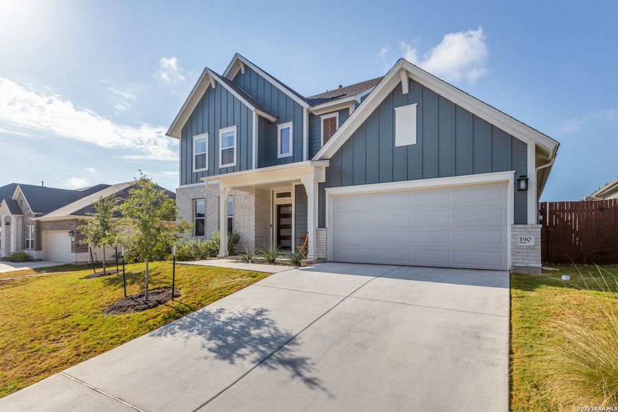 Front exterior of a new home in Sunfield, Buda, TX, highlighting curb appeal (Image 2). Front exterior of a new home in Sunfield, Buda, TX, highlighting curb appeal (Image 2).
