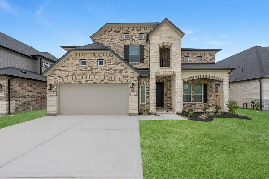 Front exterior of a new home in Morton Creek Ranch, Katy, TX, highlighting curb appeal (Image 1). Front exterior of a new home in Morton Creek Ranch, Katy, TX, highlighting curb appeal (Image 1).
