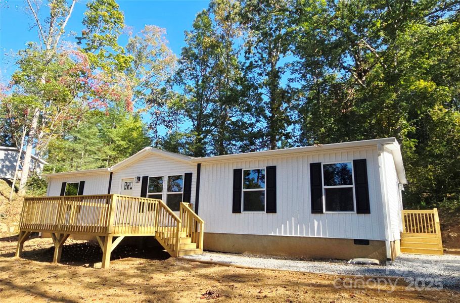 Front of home with large flat front yard. Front of home with large flat front yard.