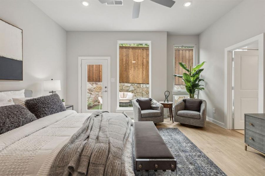 Bedroom featuring light hardwood / wood-style flooring and ceiling fan