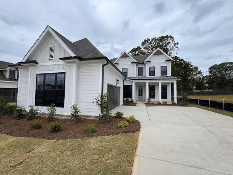 Exterior details and patio area of a home in Promenade at Sawnee Village, Cumming (Image 26). Exterior details and patio area of a home in Promenade at Sawnee Village, Cumming (Image 26).