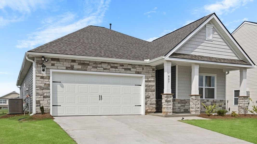 Front exterior of a new home in Woodglen, Piedmont, SC, highlighting curb appeal (Image 2). Front exterior of a new home in Woodglen, Piedmont, SC, highlighting curb appeal (Image 2).