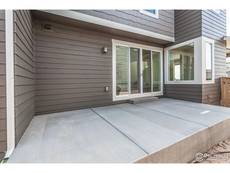Exterior details and patio area of a home in Trailside Story Collection - Single Family Homes, Timnath (Image 3).