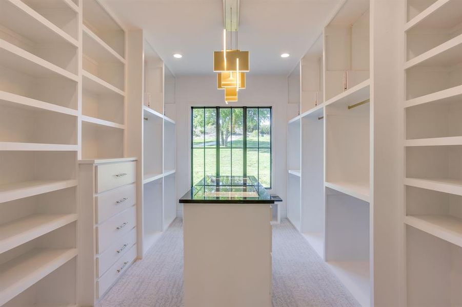 Walk in closet featuring light carpet