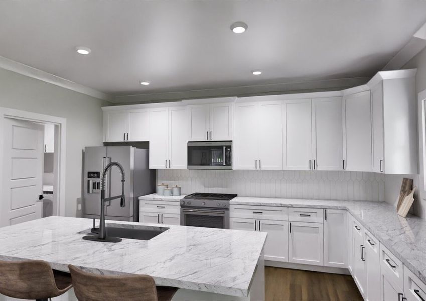 A modern kitchen featuring white cabinets and a sleek granite countertop.