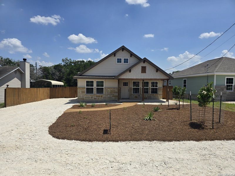 Front exterior of a new home in , Canyon Lake, TX, highlighting curb appeal (Image 25).
