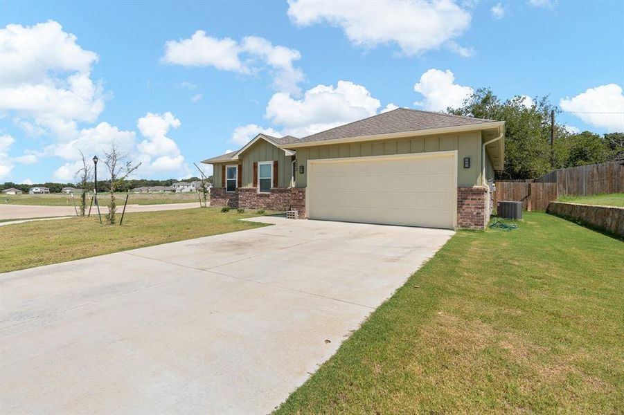 Front exterior of a new home in , Cleburne, TX, highlighting curb appeal (Image 2). Front exterior of a new home in , Cleburne, TX, highlighting curb appeal (Image 2).
