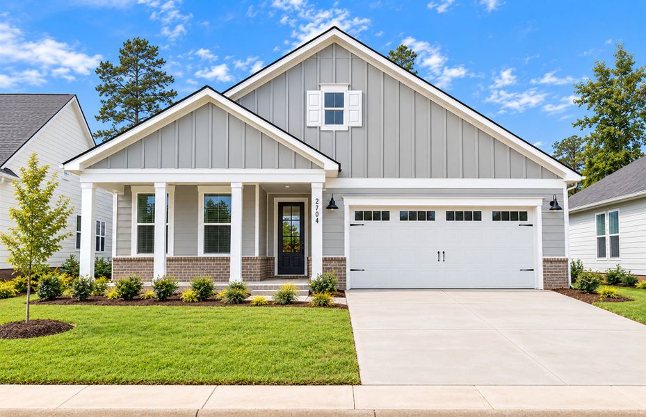 Front exterior of a new home in Del Webb Wilmington at Mallory Creek, Leland, NC, highlighting curb appeal (Image 2). Front exterior of a new home in Del Webb Wilmington at Mallory Creek, Leland, NC, highlighting curb appeal (Image 2).