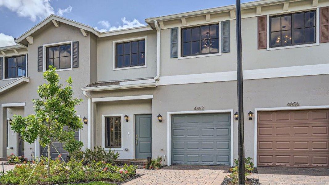Representative exterior photo of a completed home built from the Jade by D.R. Horton in Ashwood Cove, Lake Worth, FL (Image 1). Representative exterior photo of a completed home built from the Jade by D.R. Horton in Ashwood Cove, Lake Worth, FL (Image 1).