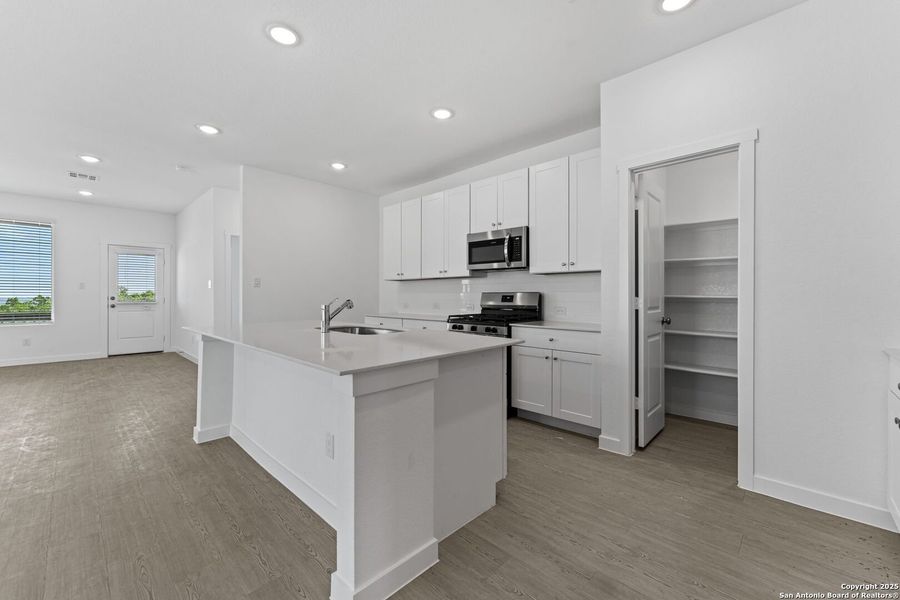 Furnished interior view inside a new home in Waterwheel: Coastline Collection, San Antonio (Image 3).