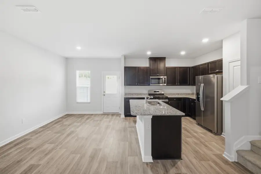 Furnished interior view inside a new home in Carpenter Falls, Durham (Image 9).