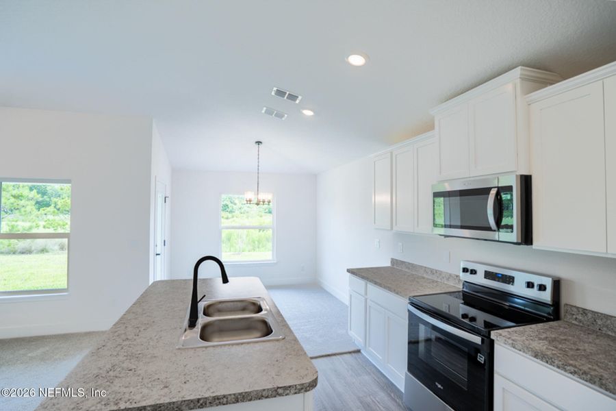Furnished interior view inside a new home in Summerglen, Jacksonville (Image 4).