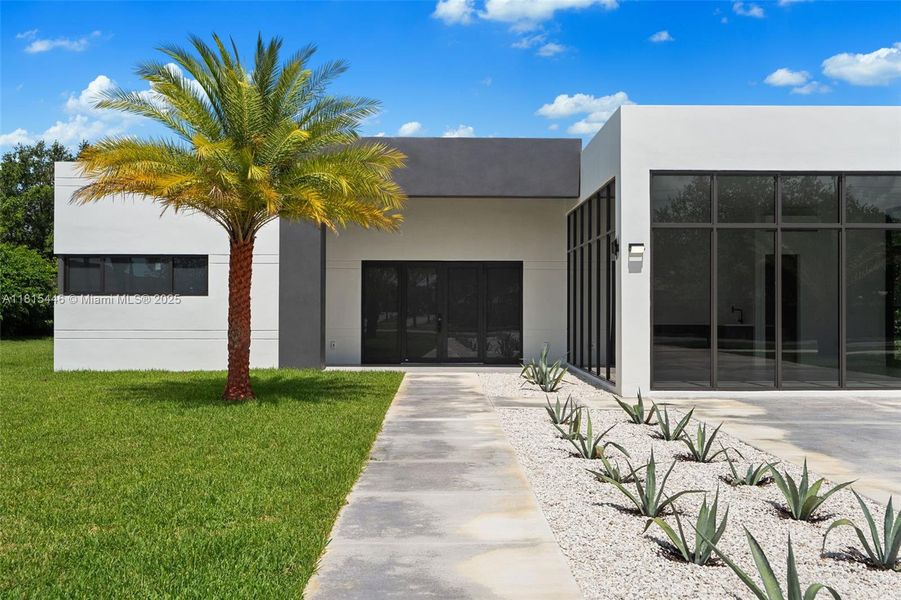 Front exterior of a new home in , Homestead, FL, highlighting curb appeal (Image 19).
