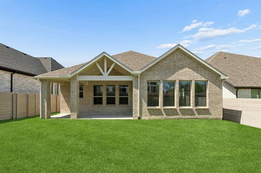 Exterior details and patio area of a home in Painted Tree Woodland West, McKinney (Image 19).