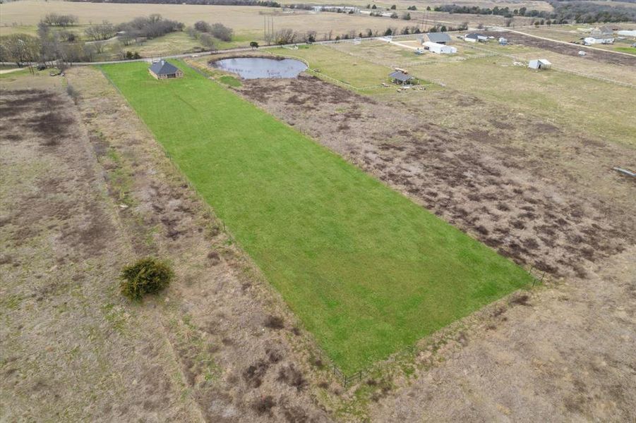 Drone / aerial view featuring a water view and a rural view