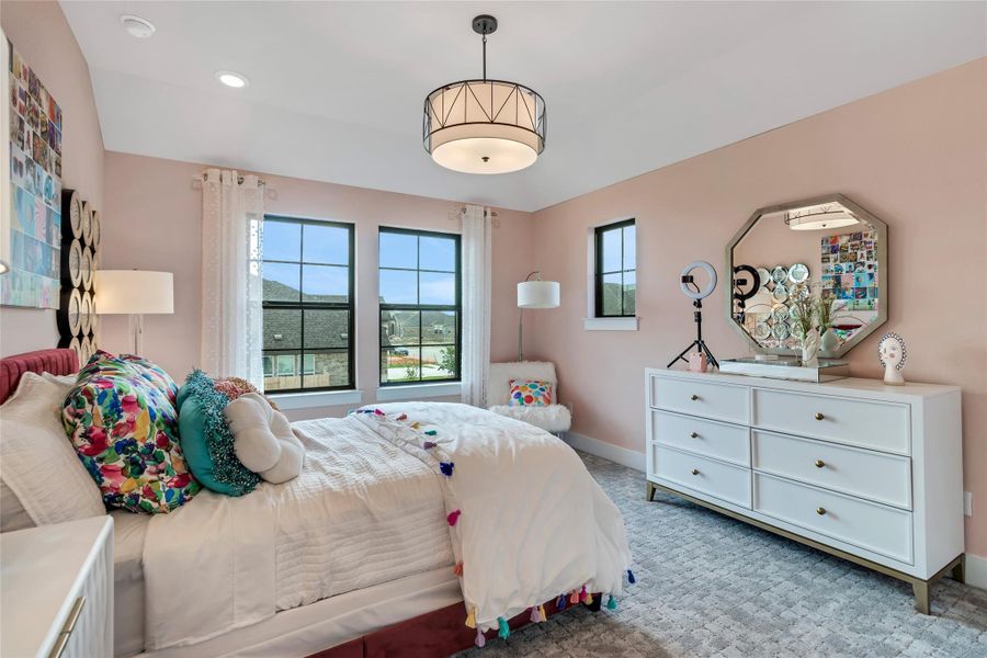 Carpeted bedroom with baseboards and recessed lighting Carpeted bedroom with baseboards and recessed lighting