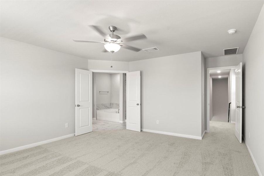 Unfurnished bedroom with baseboards, light carpet, and ceiling fan