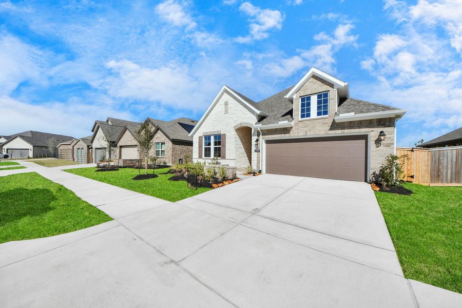 Front exterior of a new home in Bridgeland: Heritage Collection, Cypress, TX, highlighting curb appeal (Image 17). Front exterior of a new home in Bridgeland: Heritage Collection, Cypress, TX, highlighting curb appeal (Image 17).