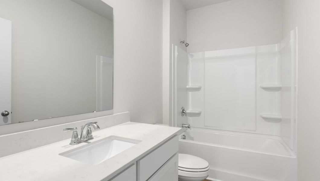 Representative furnished interior of a home built from the KERRY by D.R. Horton in Cedar Hill Landing, Navassa (Image 12).
