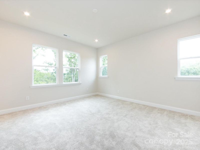 Primary Suite Surrounded by Windows and Loads of Light