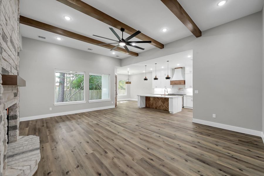 Spacious family room with cozy gas fireplace anchors this well-appointed floor plan