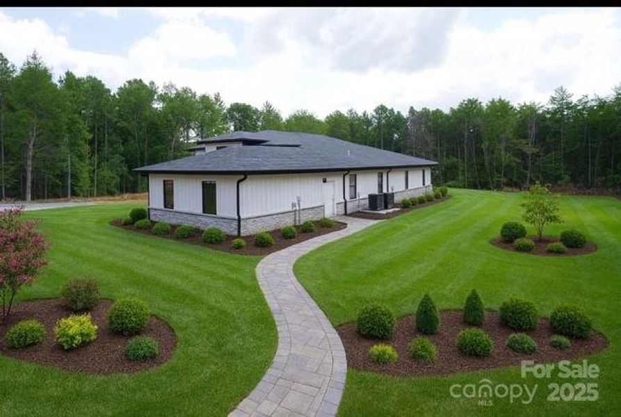 Front exterior of a new home in , Monroe, NC, highlighting curb appeal (Image 1). Front exterior of a new home in , Monroe, NC, highlighting curb appeal (Image 1).