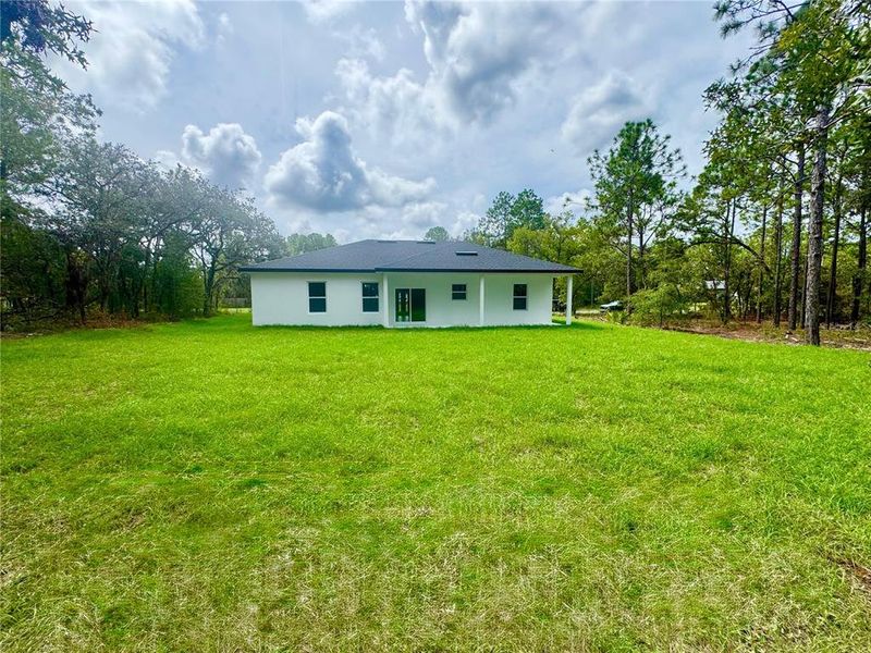 Front exterior of a new home in , Citrus Springs, FL, highlighting curb appeal (Image 21).