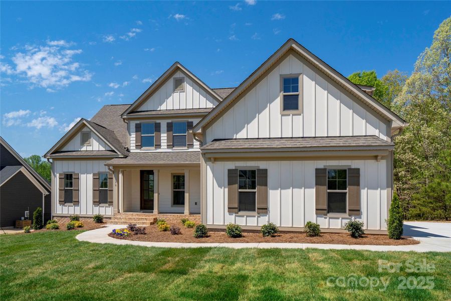 Please Note Photos are of completed home with similar finishes.   Plan to be reversed on this homesite